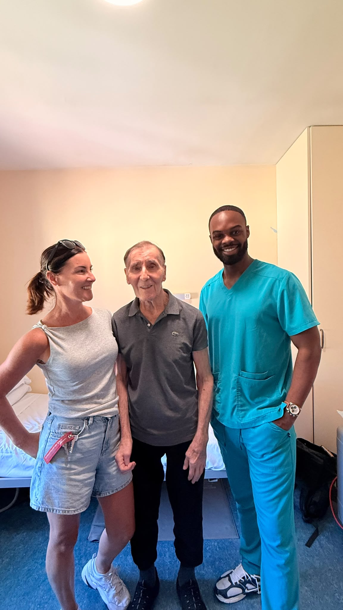 Dr. Olayinka Ibrahim with a patient and family member during a GoDental mobile dental visit in Dublin, Ireland